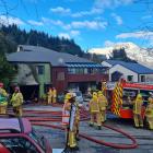 Emergency services at the scene of the fire in Fernhill, Queenstown. Photo: Cass Marrett