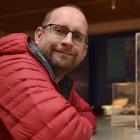 University of Otago paleogenetics laboratory director Dr Nic Rawlence with a 25 million-year-old...