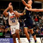 Nuggets guard Nikau McCullough shoots past Giants forward Trey Mourning during their NBL clash at...
