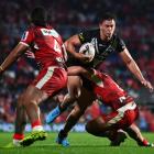 New Zealand's Joseph Manu tries to bust through the Tongan defence. Photo: Getty Images