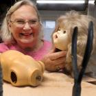 Joyce Reilly works on one of her favourite patients, a walkie talkie doll, at the Dolls City...