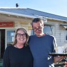 Former Arrowtown residents Cate Macdonald and Sebastiaan Bruinsma stand with a tray of coffees...