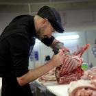 Butcher Isaac Webster, of Dunedin, practises his plan to add value to meat ahead of competing in...