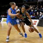 Southern Hoiho forward Laina Snyder tries to keep Queens attacker Jaime Nared at bay in...