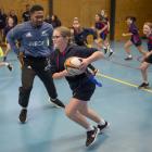 Mckenzie Larsen steps past All Black Folau Fakatava during a Rippa Rugby game at Balmacewen...