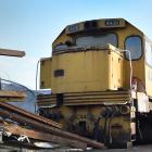 Joe Good, of Sims Pacific Metal, walks past two locomotives which are to be dismantled and cut up...