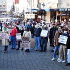 More than 100 people rally in the Octagon, in Dunedin, on Saturday to support Americans who have...