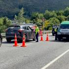 The Otago Lakes Central safer roads team conducts a breath-screening checkpoint in Arthurs Point....