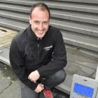 With a smart water meter at the Cerebos Greggs factory in Forth St, Dunedin, is Peter Renton,...