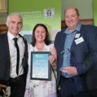 Forestry Minister Stuart Nash (left) presents Southland dairy farmers Stefan and Annalize du...