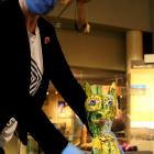Collections manager Anne Harlow arranges Seated Dog by Jim Cooper in pride of place at Tuhura...