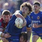 Otago’s Thomas Umaga-Jensen looks to offload the ball as he is taken in a tackle in an NPC match...