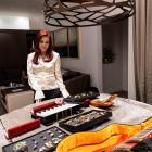 Priscilla Presley looks at a collection of personal jewellery of Elvis Presley and Colonel Tom...