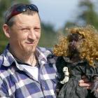 Kaitangata artist Frankie "Tazer" Harris poses with one of his gothic dolls, "Kinetic Kaye",...