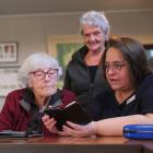 Clutha libraries digital programmes co-ordinator Dalene Breytenbach guides Lawrence residents...