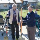 Ribbonwood Country Home residents Sadie Lietze (99, left) and Joyce Kane (95) prepare to turn a...