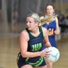 College A wing attack Zoey Flockton looks for an outlet during the Dunedin premier netball...