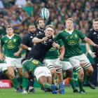 All Blacks captain Sam Cane is hit in a tackle during the match against South Africa. Photo:...