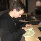 Team member Fred Sugden tests out the matcha powder on a senbei. Photo: Supplied