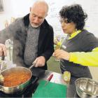 Padi Nistala guides Roger Menage on how to make a vegetable curry. PHOTO: JOHN COSGROVE