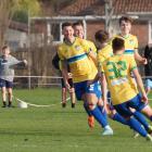 Cory Vickers (left) is about to be congratulated by Cashmere Technical teammates after scoring in...