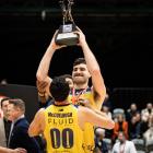 Nuggets captain Sam Timmins holds the trophy as he and teammates celebrate the win. Photo:...