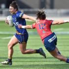Otago Spirit's Sheree Hume fends off Jaimie Page from Tasman Mako before scoring a try at Forsyth...