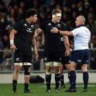 Referee Jaco Peyper talks to All Blacks Ardie Savea and Sam Cane during the second Rugby Test...