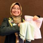 Bayfield High School head girl Sofea Haizal models the hijabs her business Piller has created...