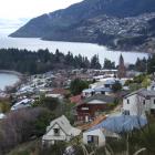 A view of Queenstown Hill (foreground), Queenstown Bay and the suburb of Fernhill in the distance...