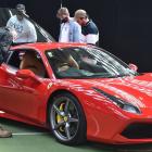 A 2016 Ferrari 488 GTB caught the eye of a group of men on Saturday. PHOTOS: GREGOR RICHARDSON