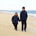 Kalya Kandegoda Gamage (right) rescued younger brother Kithmi from violent swells off Chrystalls...