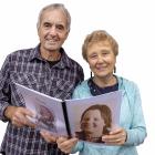 Jock and Pat Johnston with the book containing daughter Trudi’s weekly newspaper columns. Photo:...