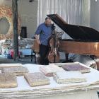 Musical interlude . . . Mark plays his cello in his studio surrounded by art, bound books made...