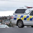 A police car blocks off Balmacewen Rd this morning. Photo: Staff photographer
