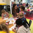 Enjoyment . . . Children enjoy working on crafts with visiting author Emma Wood. PHOTO: SUPPLIED