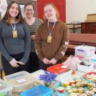 Volunteers (from left) Emily Braid, Tamsin Greer and Chloe Smith took a turn on the cake stall....
