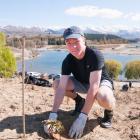 Cromwell College year 10 pupil Thomas Piebenga (15) plants native trees at the community planting...