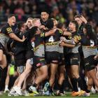 Panthers players celebrate their victory over the Eels at Accor Stadium in Sydney. Photo: Getty...