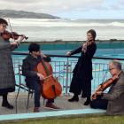 Playing to the public at the St Clair Hot Salt Water Pool yesterday are New Zealand Symphony...