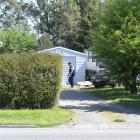 Police canvas the Momona property where a man was stabbed during an altercation on Saturday and...
