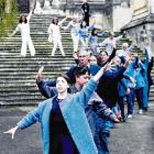 Dunedin residents take part in Us, a choreographed processional mass movement event, as part of...