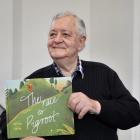 Victor Gray with a new children’s book inspired by his adventure more than 60 years ago. Photo:...