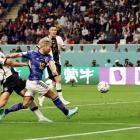 Japan's Takuma Asano scores their second goal against Germany. Photo: Reuters