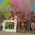 Participants in the Cromwell College 2022 Colour Run celebrate at the end of the event on...