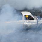 Richie Marsh, of Balclutha, concludes his burn-out heat at the Lawrence Car Club Rev, Rock &amp;...