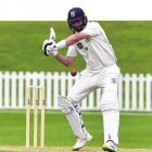 Otago seamer Travis Muller launches into a cut shot during a Plunket Shield game against Northern...