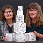 Dunedin artists Lynn Taylor (left) and Marion Mertens examine some of Taylor’s work which...