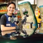 By day, Kyah Matthews paints cars. By night, she turns her talents with a spray gun on people....