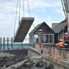 A set of steps is eased into position next to the St Clair Hot Salt Water Pool in Dunedin...